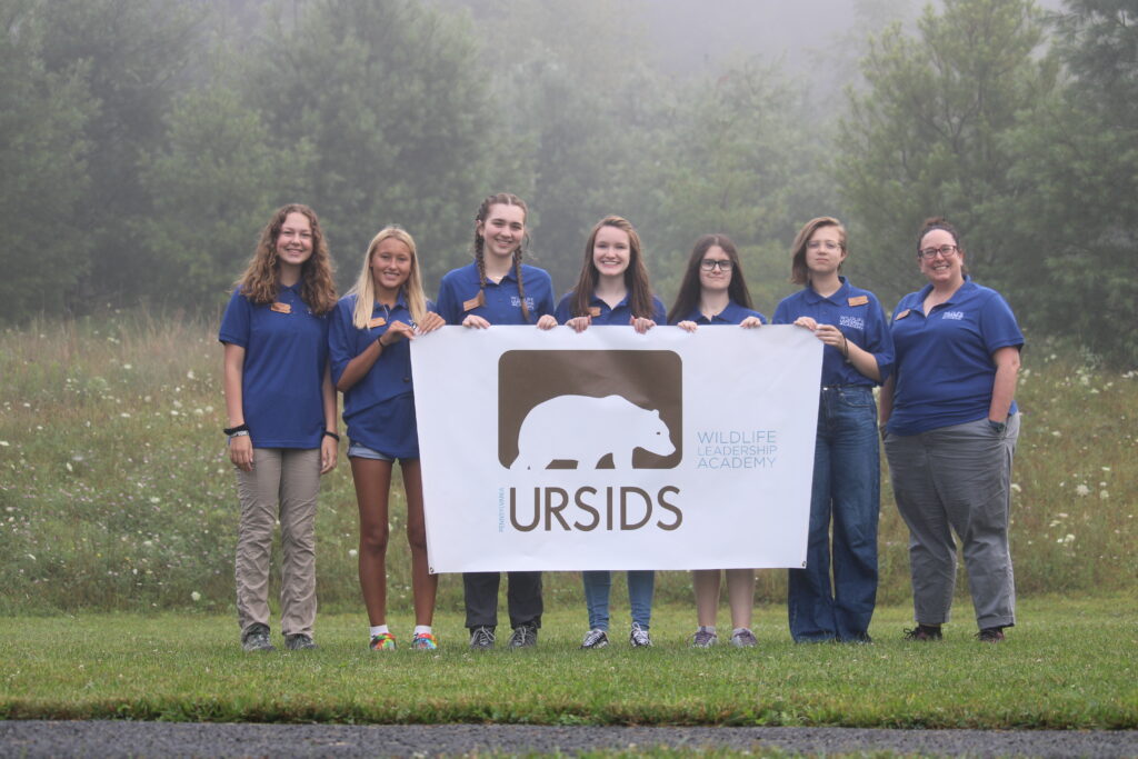Evangeline's team posing with the PA Ursids field school banner